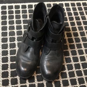 Black booties with buckle detail